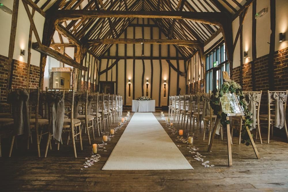 The barn aisle lined with fairy lights