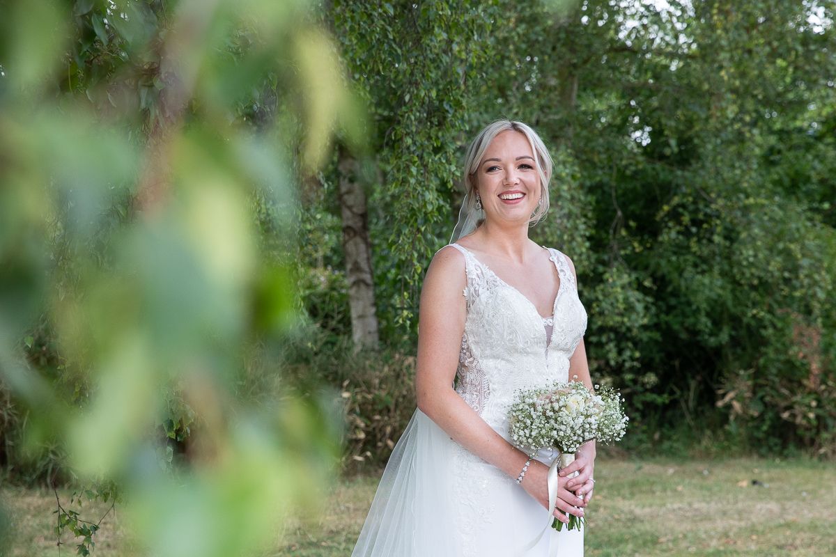 Newlyweds in the grounds at golden hour